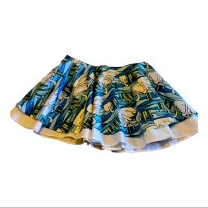 New . Unique swan print , two layered mini skirt.  Size four.  Never worn.